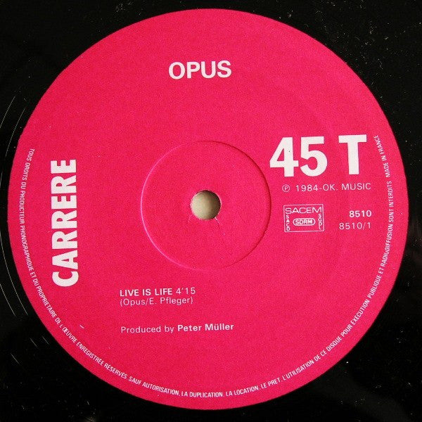Opus - 1984 French Vinyl 12 - Inch 45 RPM Maxi - Single Pop Rock Record - Live Is Life / Up And Down (VG+ Condition) by Carrere Label